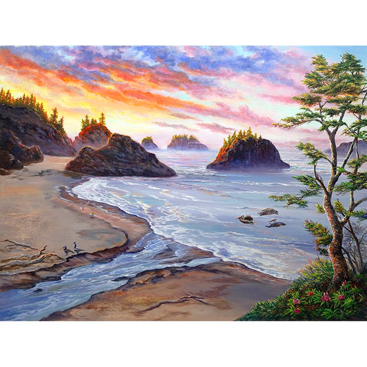 A painting of a vibrant sunset illuminates Secret Beach on the Oregon Coast, featuring dramatic rock formations rising from the ocean, gentle waves lapping at curved sandy shores, and windswept trees framing the scene. Golden-orange sky reflects on the water while evergreen forests crown the rocky outcrops. By Jeanne Warren