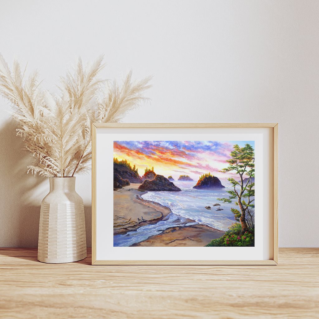 Secret Beach Oregon Coast Sunset Art Print  by Jeanne Warren, showcasing a dramatic coastal landscape at dusk, featuring rugged sea stacks, pristine sandy beach, and crashing waves against rocky shores, set against a vibrant sky painted in golden orange and purple hues, framed with coastal pine trees and displayed in a natural wood frame